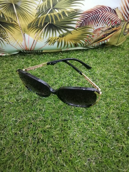 Lentes de sol con protección UV - Redondos Negros detalle dorado