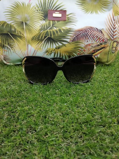 Lentes de sol  con protección UV - Redondos Negros detalle dorado